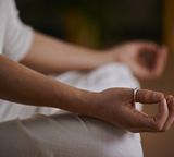 yoga meditation hands sitting closeup