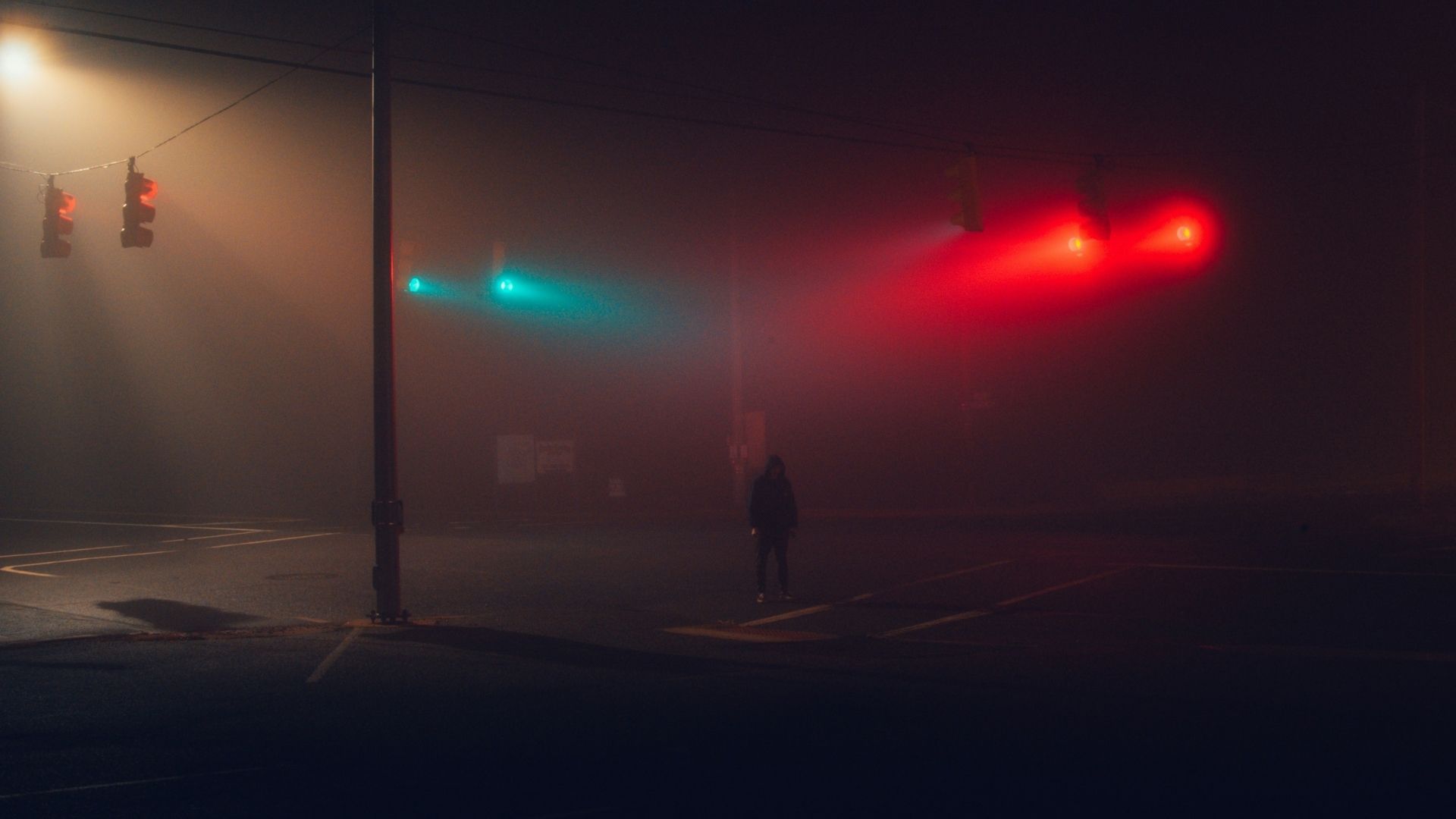 human standing on street with spot on